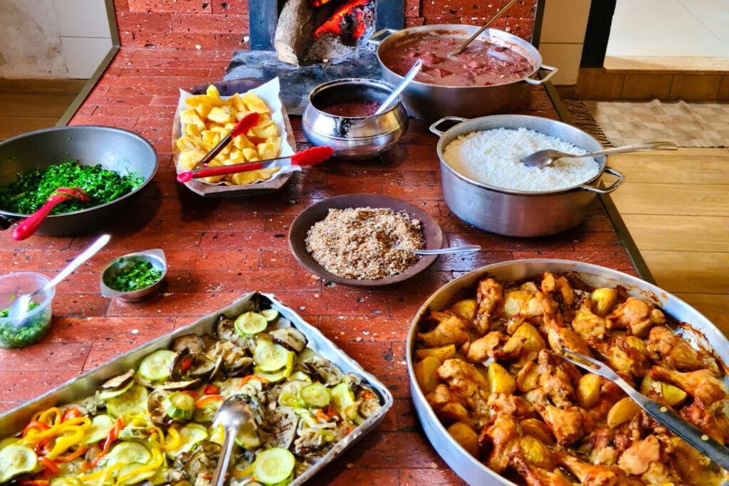 A colorful spread of homemade dishes on a wooden table.